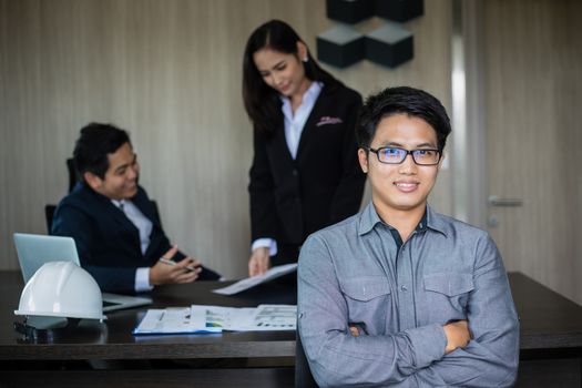 Asian business man and group using notebook for meeting and business men smiling happy for working