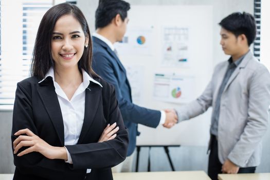 Asian business women and group using notebook for meeting and business women smiling happy for working