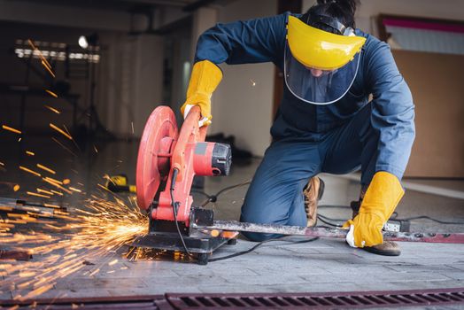 Craftsman Welding is Cutting Steel Work, Welder Man in Safety Protective Equipment Doing Metalwork in Construction Site. Engineering Labor Skill and Workshop Production Concept