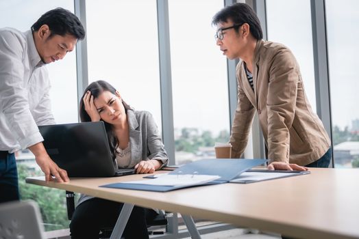 Businesspeople Teamwork are Seriously During Meeting Together, Business Woman Having Upset While Looking Result of Business Profit. Management Leader is Dissatisfied About Project Their Team Execution