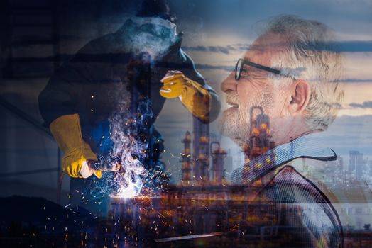 Double Exposure of Welder is Welding Pipeline Fabrication Assembly on Oil and Gas Refinery Manufacturing Plant Background. Technician Welding in Safety Protective Equipment is Working Metalwork.