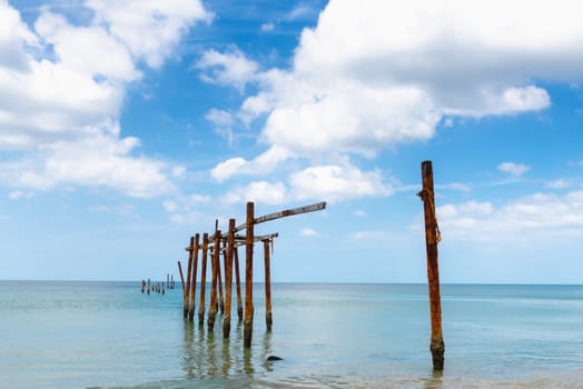 Landscape Seascape Scenery View With Old Bridge Structure Pole Against Blue Sky Background. Perspective Long Beach and Tropical Horizon Seaside View, Natural Backgrounds.