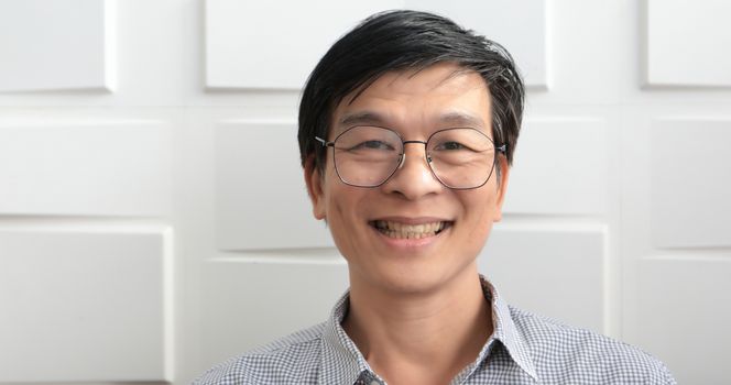 The senior Asian man smiled and laughed happy