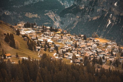 Landscape Scenery Aerial View Over The Village of Murren City From Cable Car, Switzerland. Amazing Valley View With Historic Village Against Swiss Alps at Interlaken Region. Swiss Travel Destination