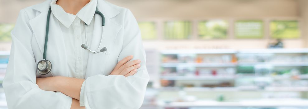 Medical Doctor or Pharmacist Healthcare in Pharmacy Shop, Physician Doctor Standing and Arm Crossed in front of Medicine Drugstore. Medic Health Care and Apothecary Pharmaceutical Occupation Concept.