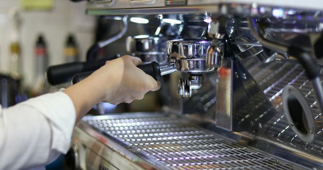 Asian women Barista smiling and using coffee machine in coffee shop counter - Working woman small business owner food and drink cafe concept