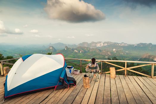 Landscape Scenery Mountains View With Camping Tent on Wooden Terrace for Outdoors Leisure Activity Relaxation. Beautiful Scenic of Nature From Camp Site Viewpoint, Adventure/Vacation Lifestyles