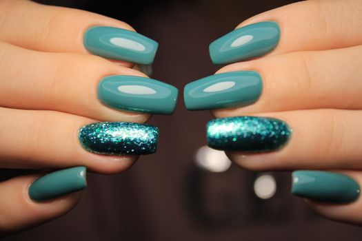 Beautiful woman's nails with beautiful christmas manicure studio