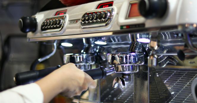 Asian women Barista smiling and using coffee machine in coffee shop counter - Working woman small business owner food and drink cafe concept