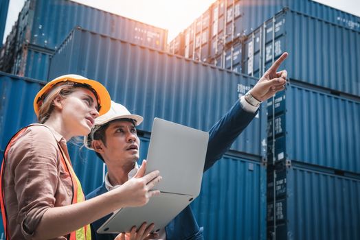 Business Team Container Cargo Shipping Control Inspection Loading Dock and Management Import/Export Freight at Port Ship Yard. Manager and Foreman Teamwork Inspecting Containers Shipment Warehouse.