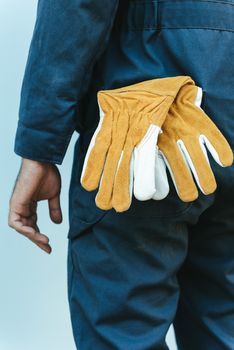 Close-Up of Mechanic Technician Hand and Leather Gloves While Standing in front of Maintenance Workshop, Technical Service Worker Preparation for Fixing Automotive in Workshops House. Mechanical Job