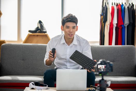 Asian man  blogger broadcasting a video for selling product online .Shopping online concept