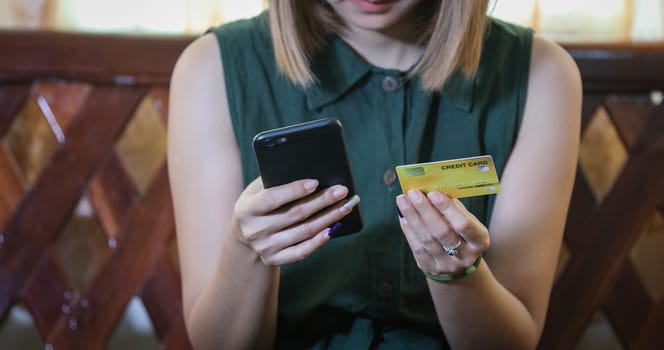 woman asian using smartphone and credit card shopping online