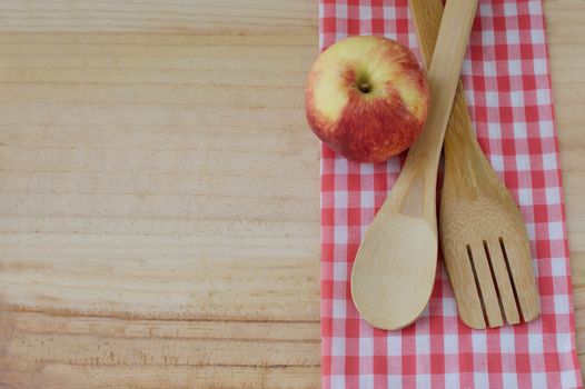 Wooden kitchen utensils  on wooden background