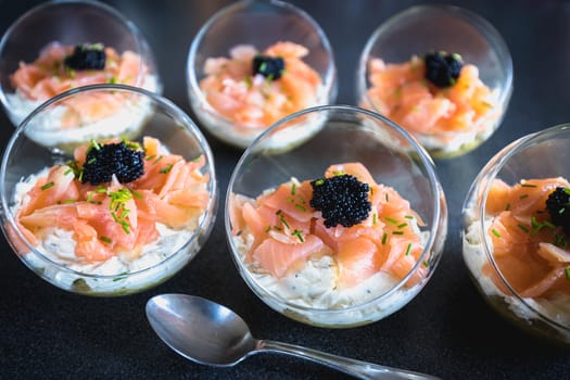 verrine salmon lumpfish egg fresh cheese and avocado bed in the kitchen