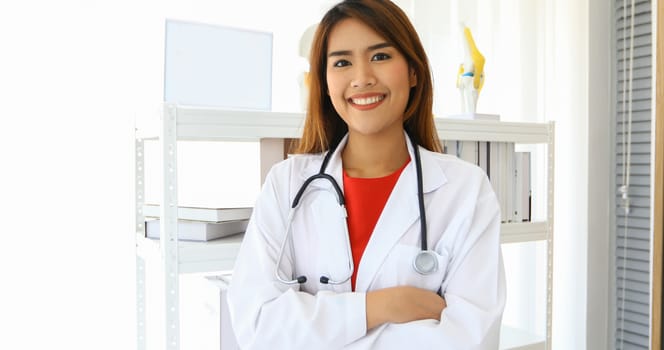 Smiling happy doctor in office