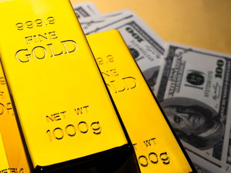 Close up of Gold bars and banknotes. financial concept