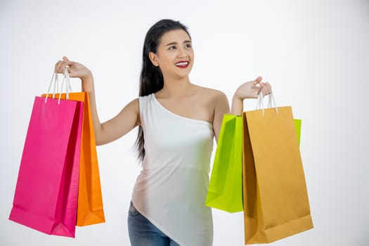 Asian women Beautiful girl is holding shopping bags and smiling