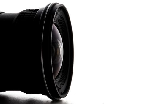 Close up of camera lens with a white background.