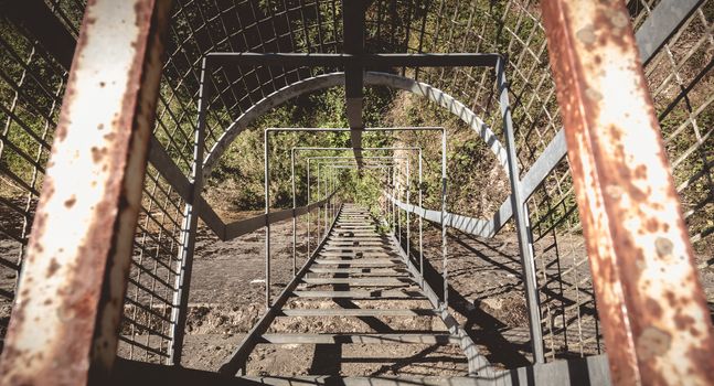 rusted secure metal ladder on a hydraulic dam in France