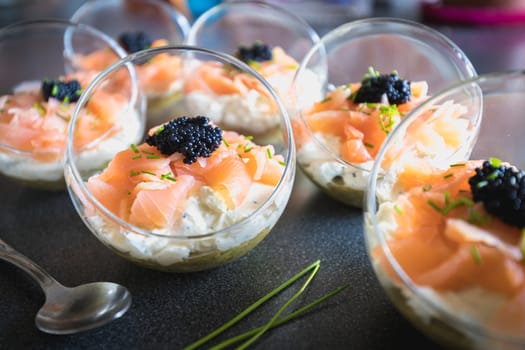 verrine salmon lumpfish egg fresh cheese and avocado bed in the kitchen