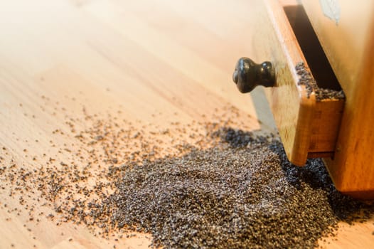 Freshly ground black pepper against a wooden table