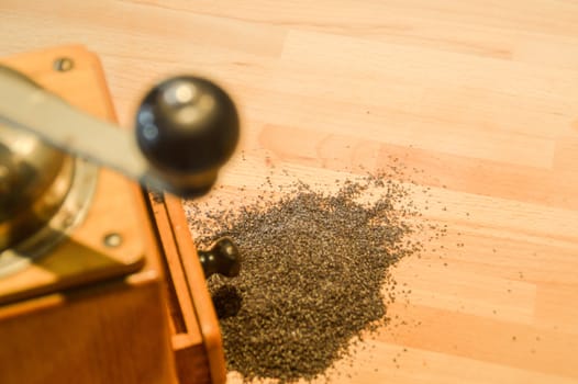 Freshly ground black pepper against a wooden table