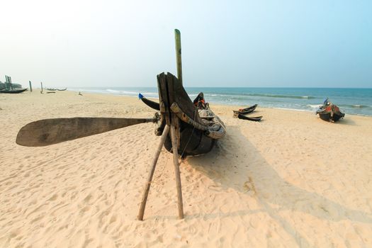 Traditional Vietnamese wooden boat moored at the beach of Hue, Vietnam