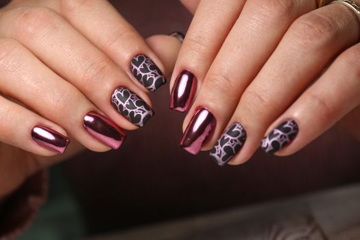 Closeup photo of a beautiful female hands with elegant manicure and diamond rings.