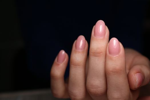 Closeup photo of a beautiful female hands with elegant manicure and diamond rings.