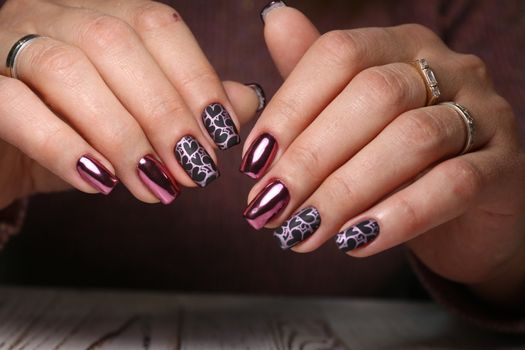 Beautiful woman's nails with beautiful christmas manicure studio