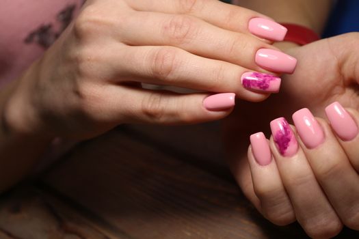 Beautiful woman's nails with beautiful christmas manicure studio