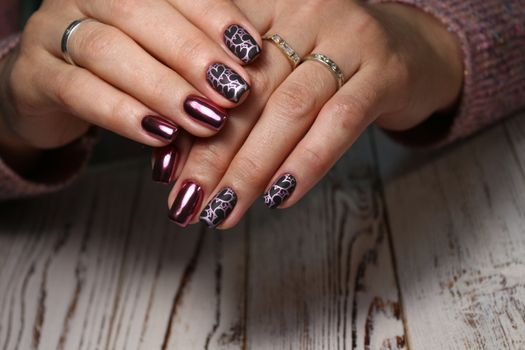 Beautiful woman's nails with beautiful christmas manicure studio