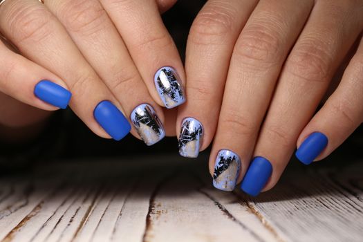Beautiful woman's nails with beautiful christmas manicure studio