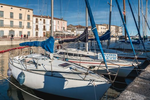 Marseillan, France - December 30, 2018: Pleasure boat docked in the small port of Marseillan on a winter day