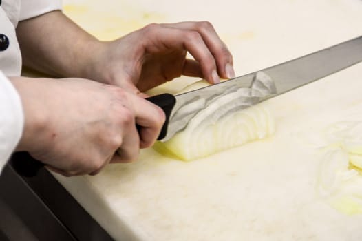 Chef preparing vegetables at a restaurant kitchen