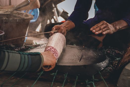Traditional Banh Trang or rice paper making in Nhon Hoa rice paper village of Vietnam that is both a livelihood and cultural tourist attraction