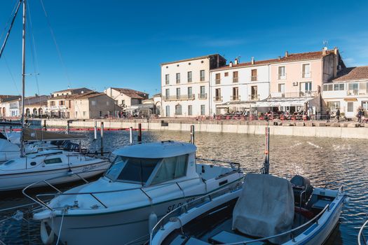 Marseillan, France - December 30, 2018: Pleasure boat docked in the small port of Marseillan on a winter day