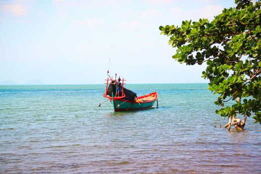 Traditional wooden khmer (Cambodian) fishing boat on the coast of Kep, showing the local culture and livelihood of the local people in Cambodia