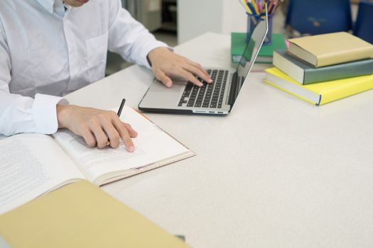 Student making research on laptop and browse internet. Education concept.