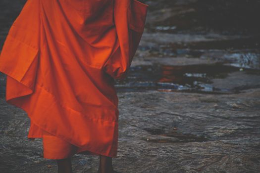 Saffron colored robe of a Buddhist monk to show the culture and religion in Cambodia