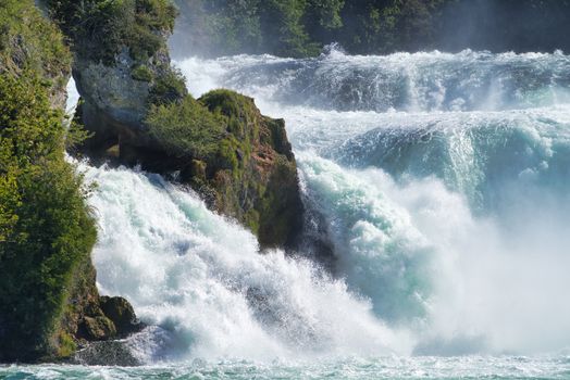 the famous rhine falls in the swiss near the city of Schaffhausen - sunny day and blue sky