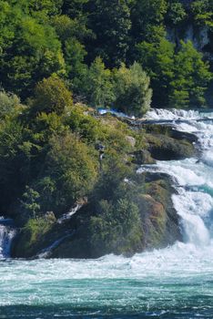 the famous rhine falls in the swiss near the city of Schaffhausen - sunny day and blue sky