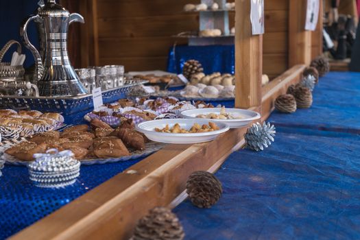 Marseillan, France - December 30, 2018: storefront of an oriental pastry shop in a small chalet of the Christmas markets on a winter day