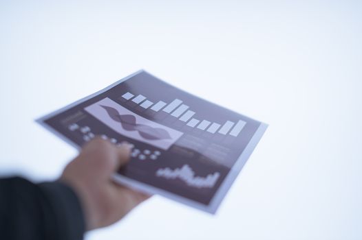 Businessman hand holding a document. Scenes white background.