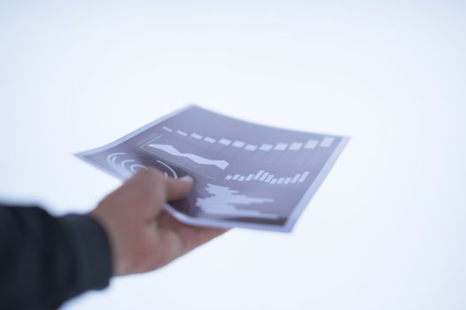 Businessman hand holding a document. Scenes white background.