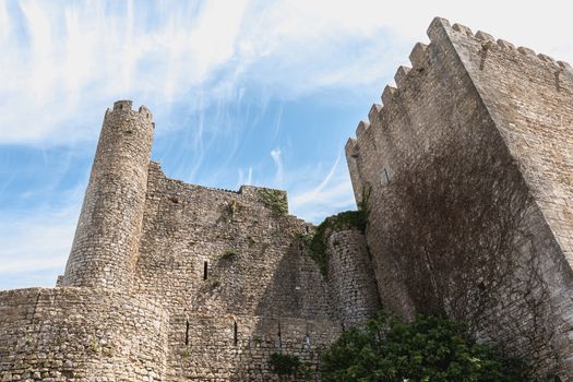 Obidos, Portugal - April 12, 2019: architectural detail of the medieval castle of Obidos on a spring day