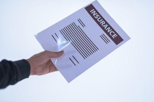 Businessman hand holding a document. Scenes white background.
