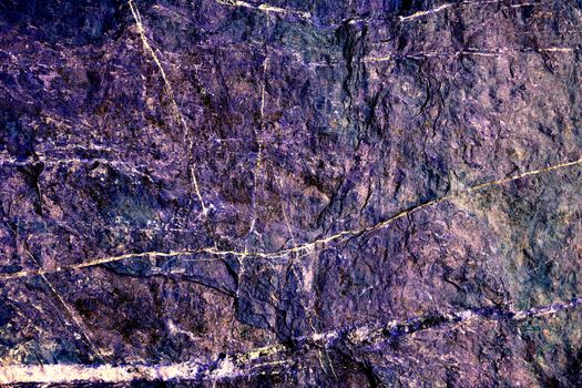 purple hard heavy granite stone surface of cave for interior wallpaper and line marble background
