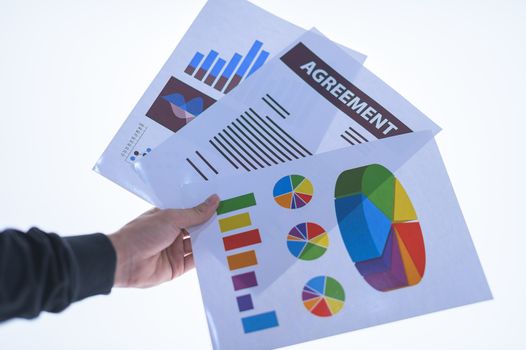 Businessman hand holding a document. Scenes white background.